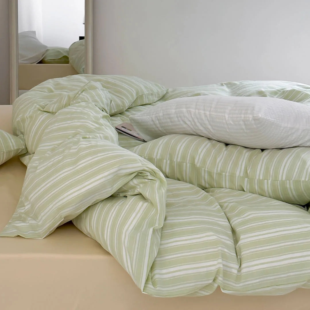 Messy Bed Look with Sage Green Striped Duvet for Danish Pastel Vibe - RoomDen