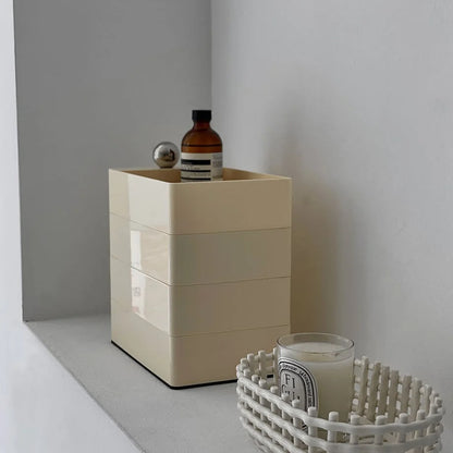 Close-up of the Cream Beige rotating organizer, highlighting its stacked, cubic form.