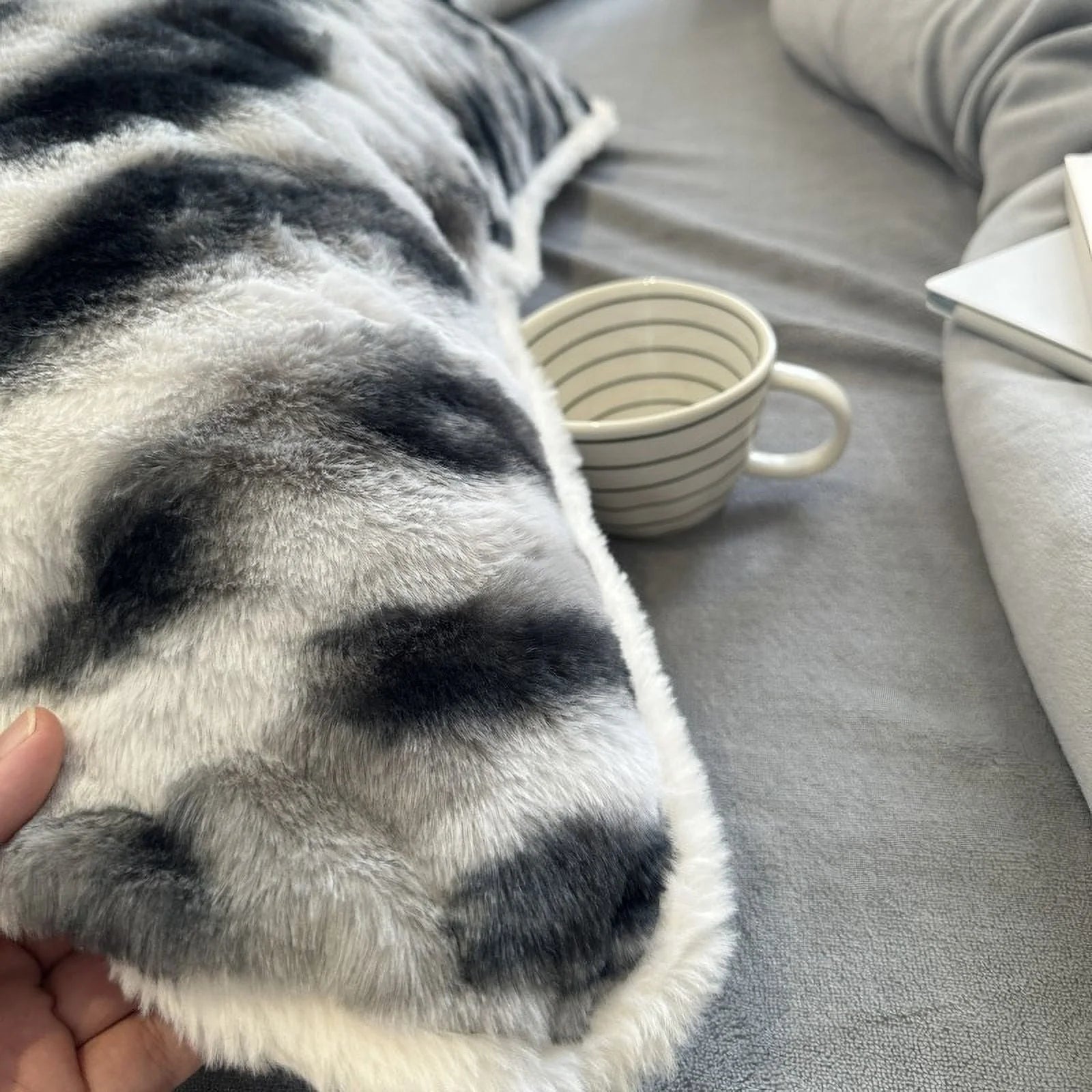Close-up shot showing the soft, fuzzy texture of the black and white flannel fleece duvet cover. - RoomDen