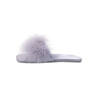 Minimalist side view of purple fluffy slipper on white background - RoomDen