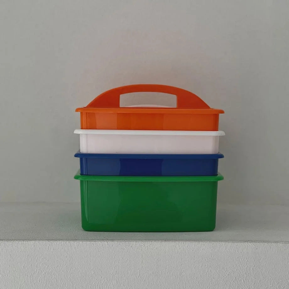 Four organizer caddies in green, blue, white, and orange stacked on top of each other. - RoomDen