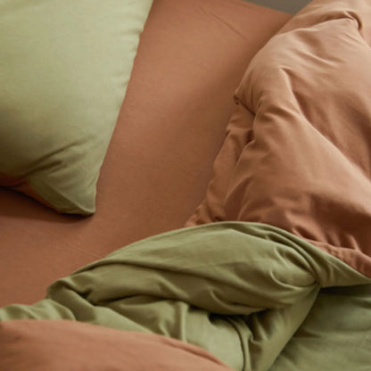 Top Down View of Reversible Olive and Cinnamon Bedding Layers - RoomDen
