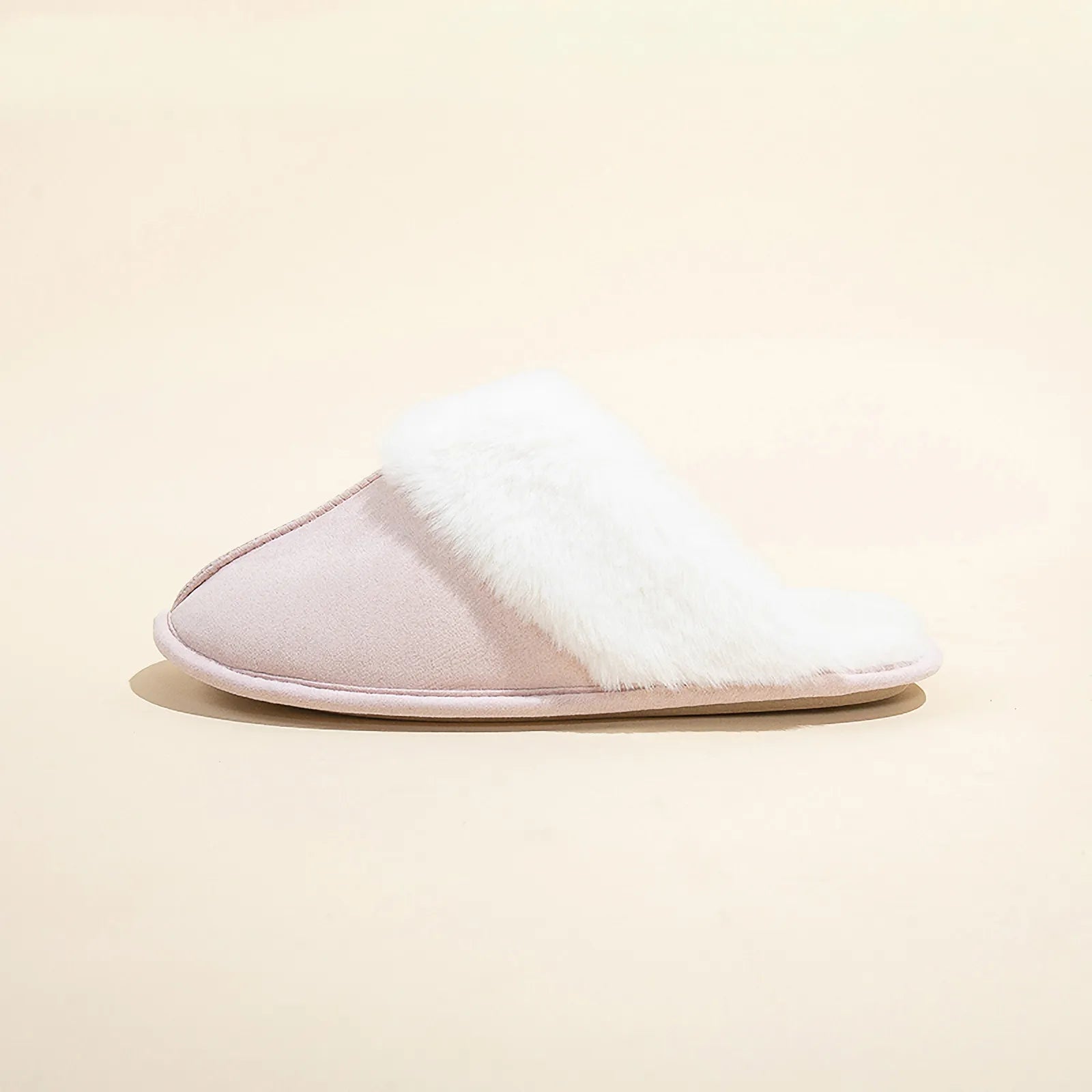 Side profile of Light Pink Faux Suede House Slipper with white fur trim.