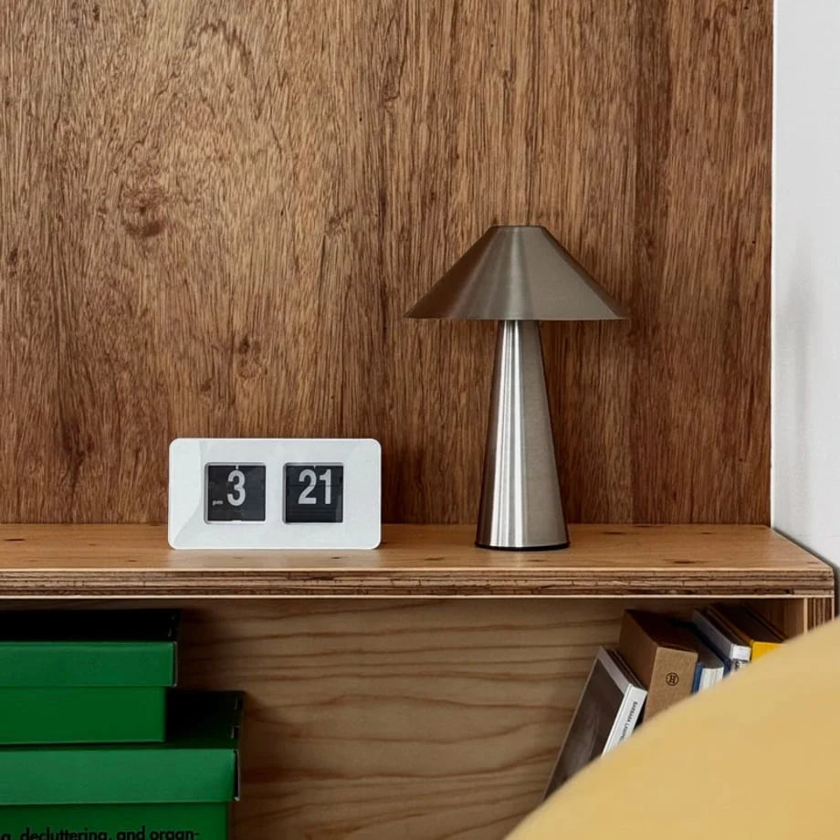 Lifestyle shot of the all-white flip clock on a wooden bedside table. - RoomDen