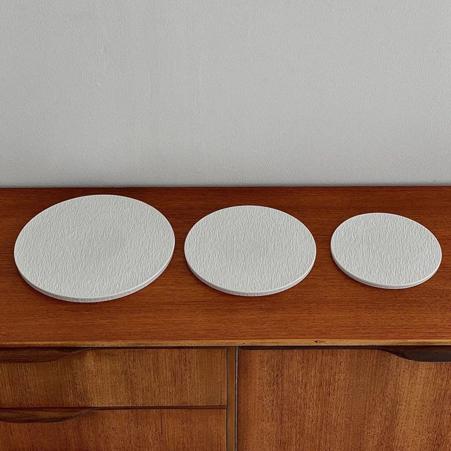 The set of three textured Wabi-Sabi ceramic trays shown without jewelry to highlight their form and size difference. - RoomDen