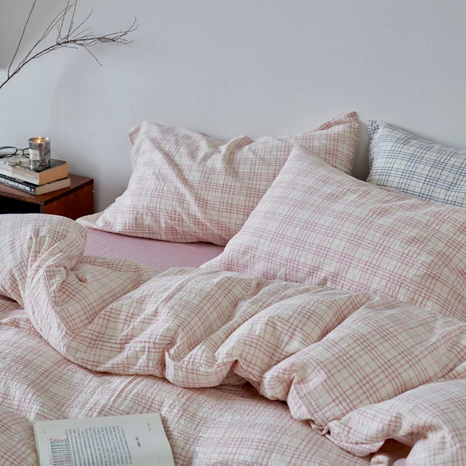 Angled view of the Dusty Pink Plaid Washed Cotton Bedding Set, highlighting its cozy and soft appearance - RoomDen