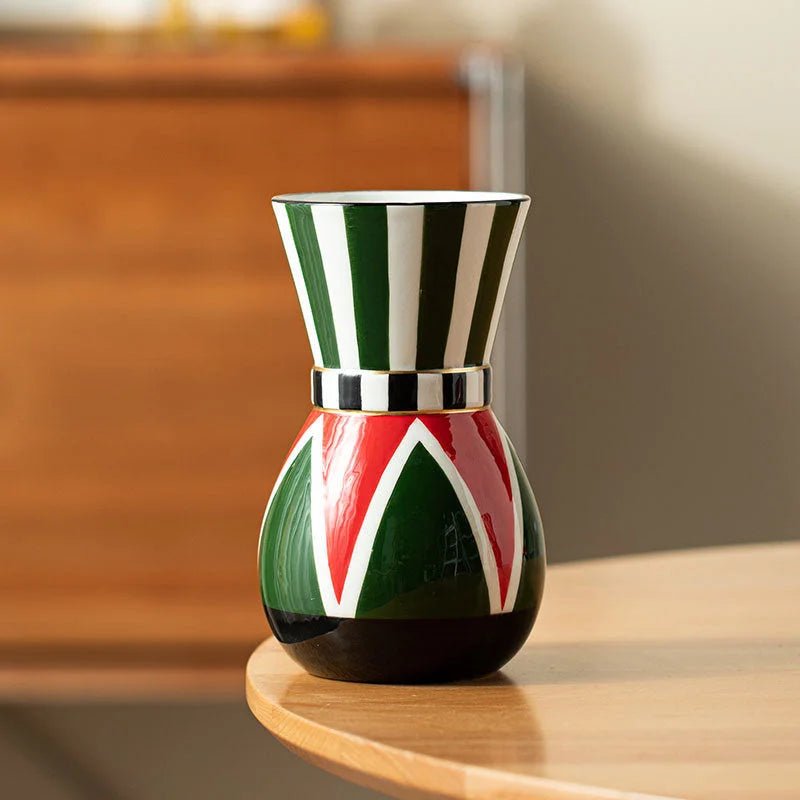 Angled view of the green-striped harlequin ceramic vase on a wood table, showing the checkered detail. - RoomDen