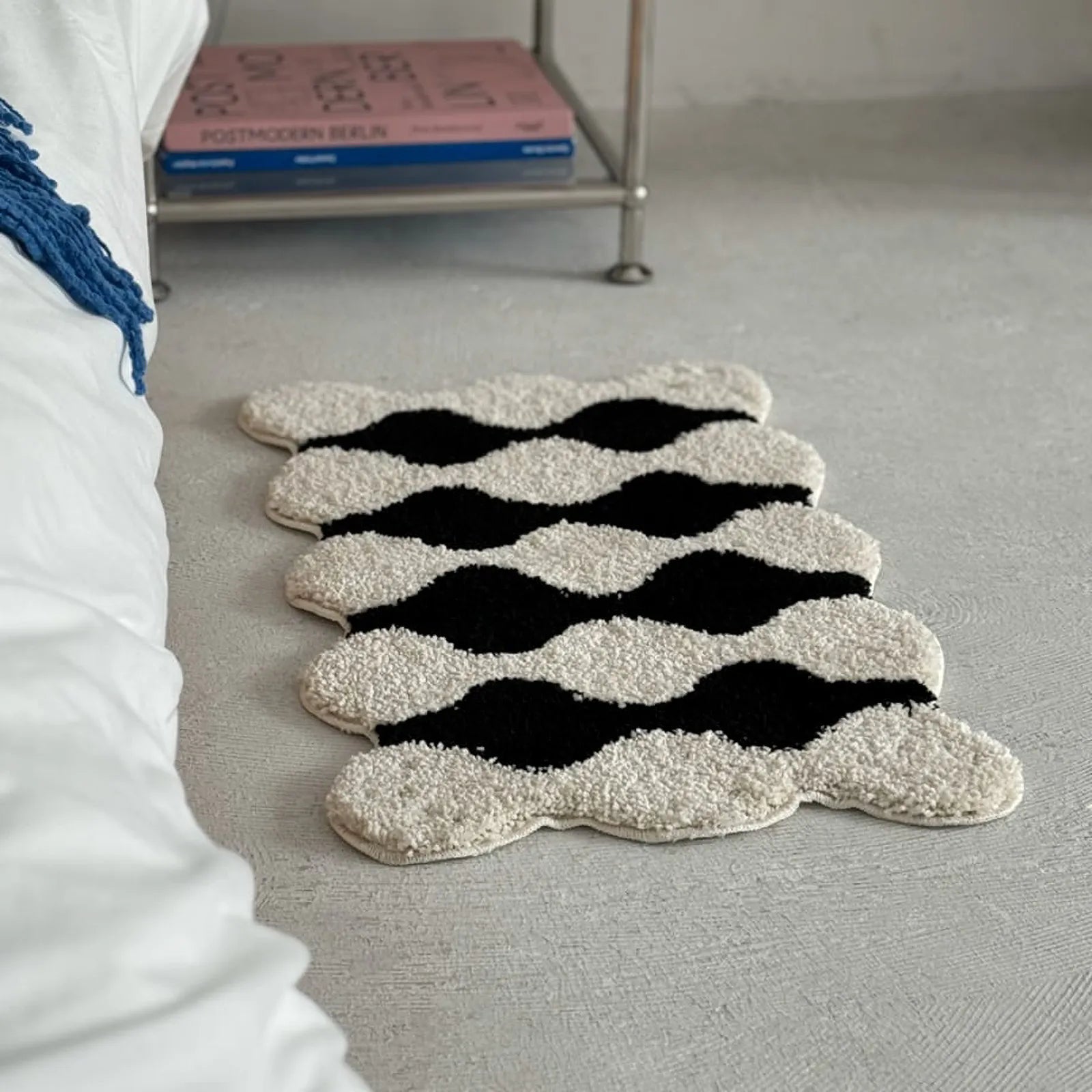 Wide angle bedroom scene featuring funky wavy accent rug - RoomDen