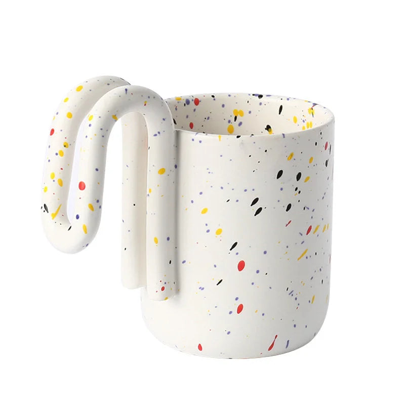 Confetti Splatter ceramic mug with sculptural loop handle on a white background - RoomDen