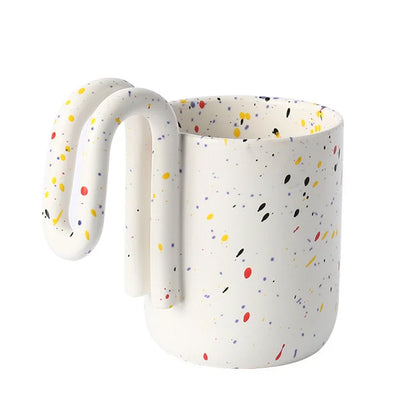 Confetti Splatter ceramic mug with sculptural loop handle on a white background - RoomDen