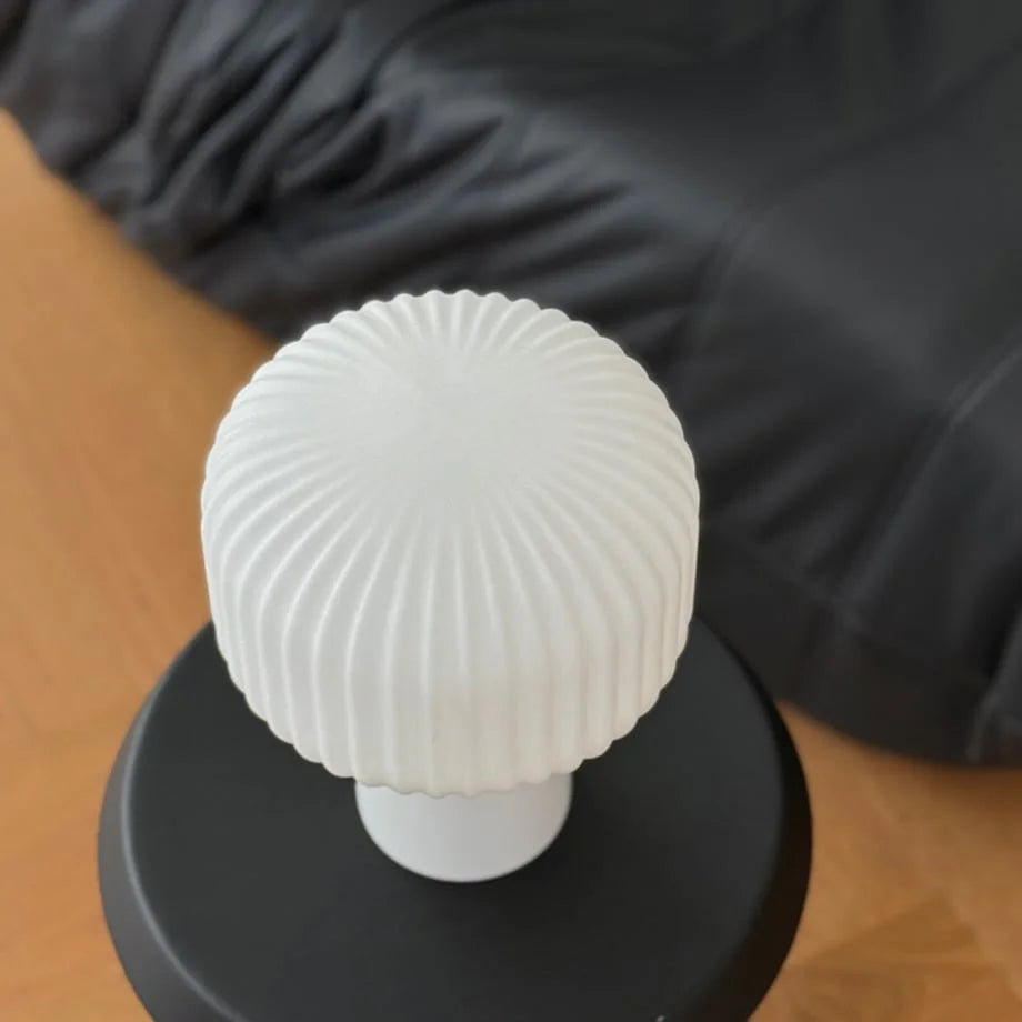 Top-down view of the pleated texture on the Creamy White Glass Mushroom Accent Lamp - RoomDen