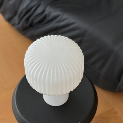 Top-down view of the pleated texture on the Creamy White Glass Mushroom Accent Lamp - RoomDen