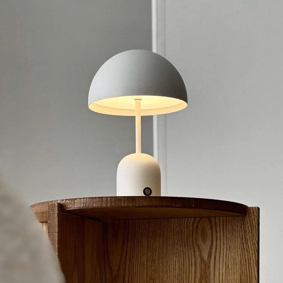 Close-up of the Off-White accent lamp illuminated with warm light - RoomDen