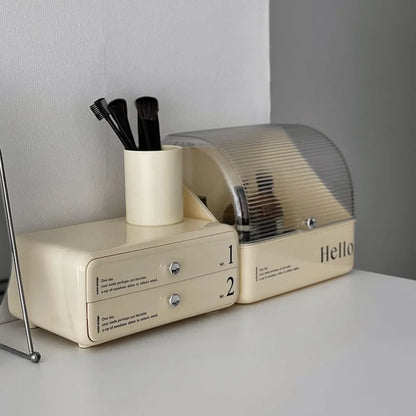 Angled lifestyle shot of the two-piece makeup organizer next to a brush holder on a desk.