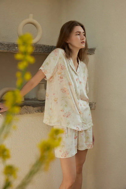 RoomDen Floral Short Sleeve Pajama - Artistic shot with yellow blurred flowers in foreground