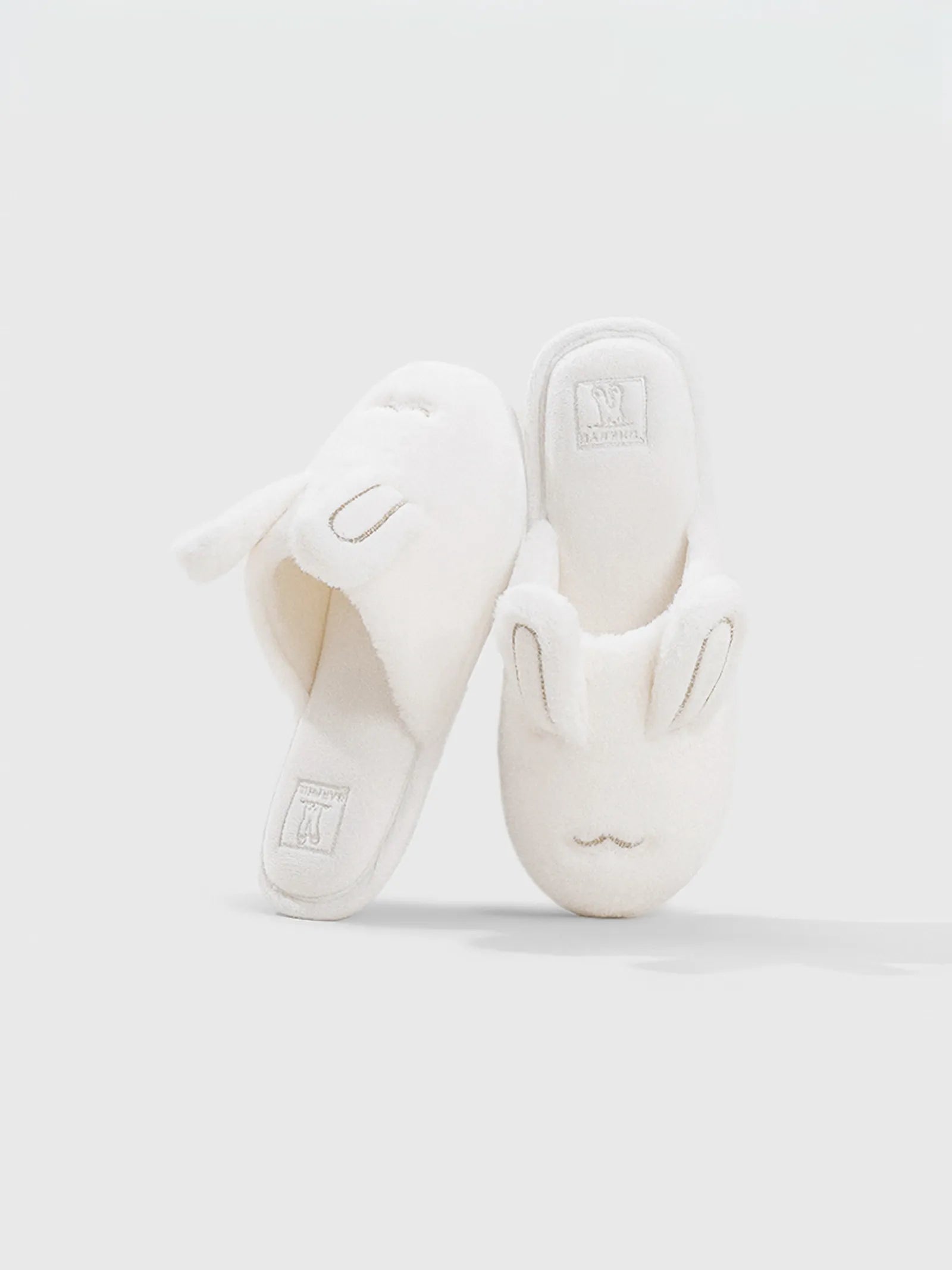 Side view of blue bunny slippers showing plush texture - RoomDen