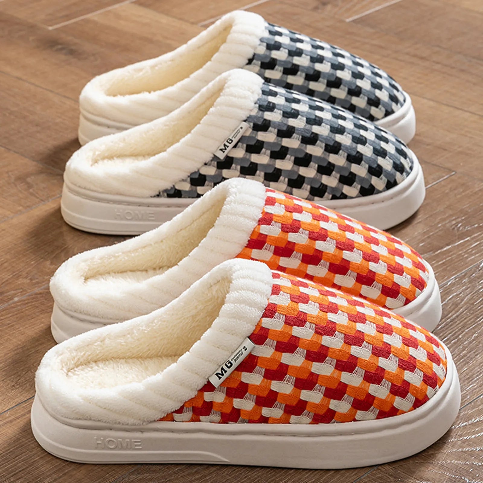 Black and grey woven gingham plush slippers leaning against wall