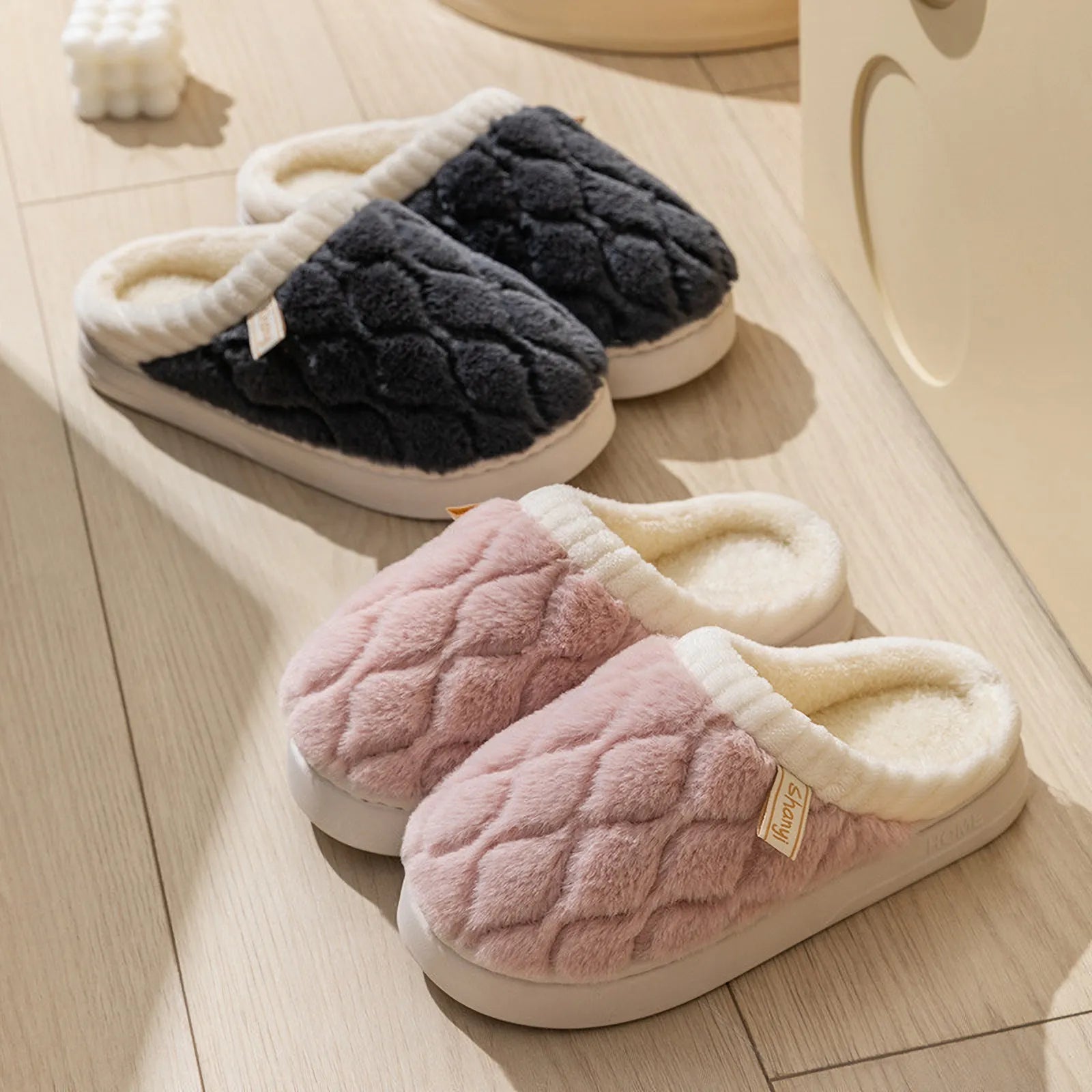 Grey and Pink fuzzy house slippers displayed together highlighting color contrast - RoomDen
