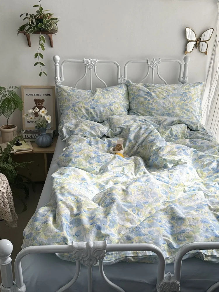 Full view of the Cottagecore-inspired bedroom with the blue and yellow floral bedding as the centerpiece.