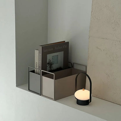 Angled view of the Japandi-style metal book holders on a shelf, highlighting their clean lines and simple form. - RoomDen