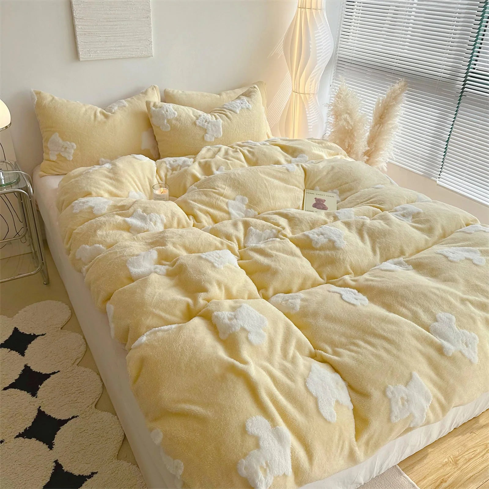 Full view of a bed with a yellow teddy bear flannel fleece bedding set in a bright, modern bedroom. - RoomDen