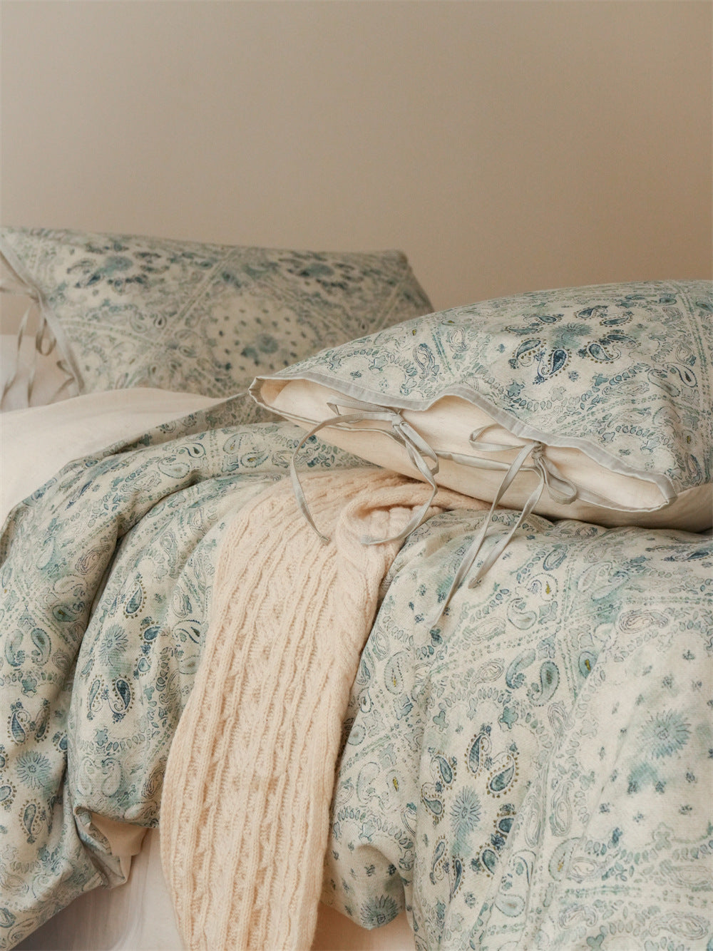 Stillgarden Blue Botanical Scroll Cotton Linen Bedding Set – Close view of patterned pillow and folded duvet - Roomden