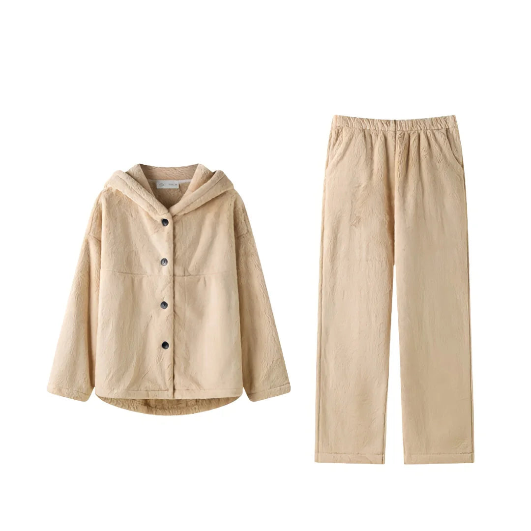 Flat lay of the beige hooded fleece pajama top and matching pants on a white background. - RoomDen