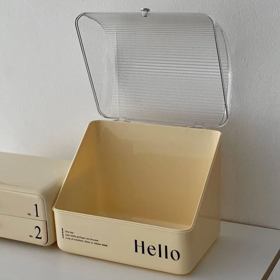 The top compartment of the makeup organizer with its flip-top lid opened, showing the empty interior.
