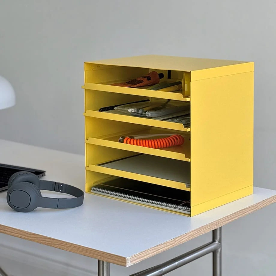 Close-up of the Sunny Yellow metal organizer filled with stationery and supplies - RoomDen.