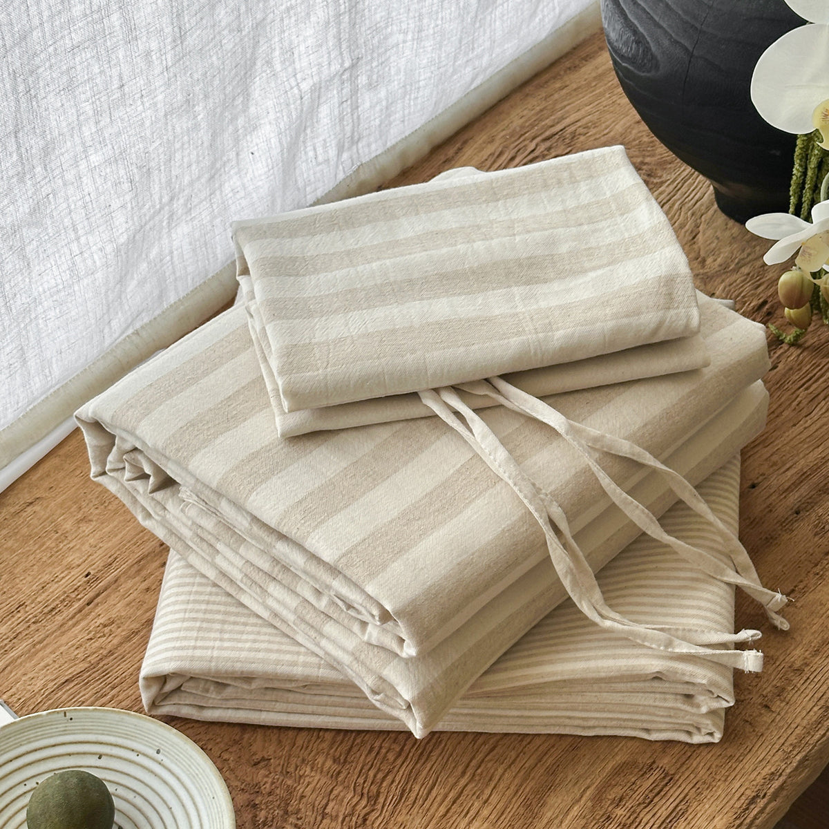 Ashfield Oat Stripe Bedding Set – Folded striped bedding with pale pillow ties - Roomden