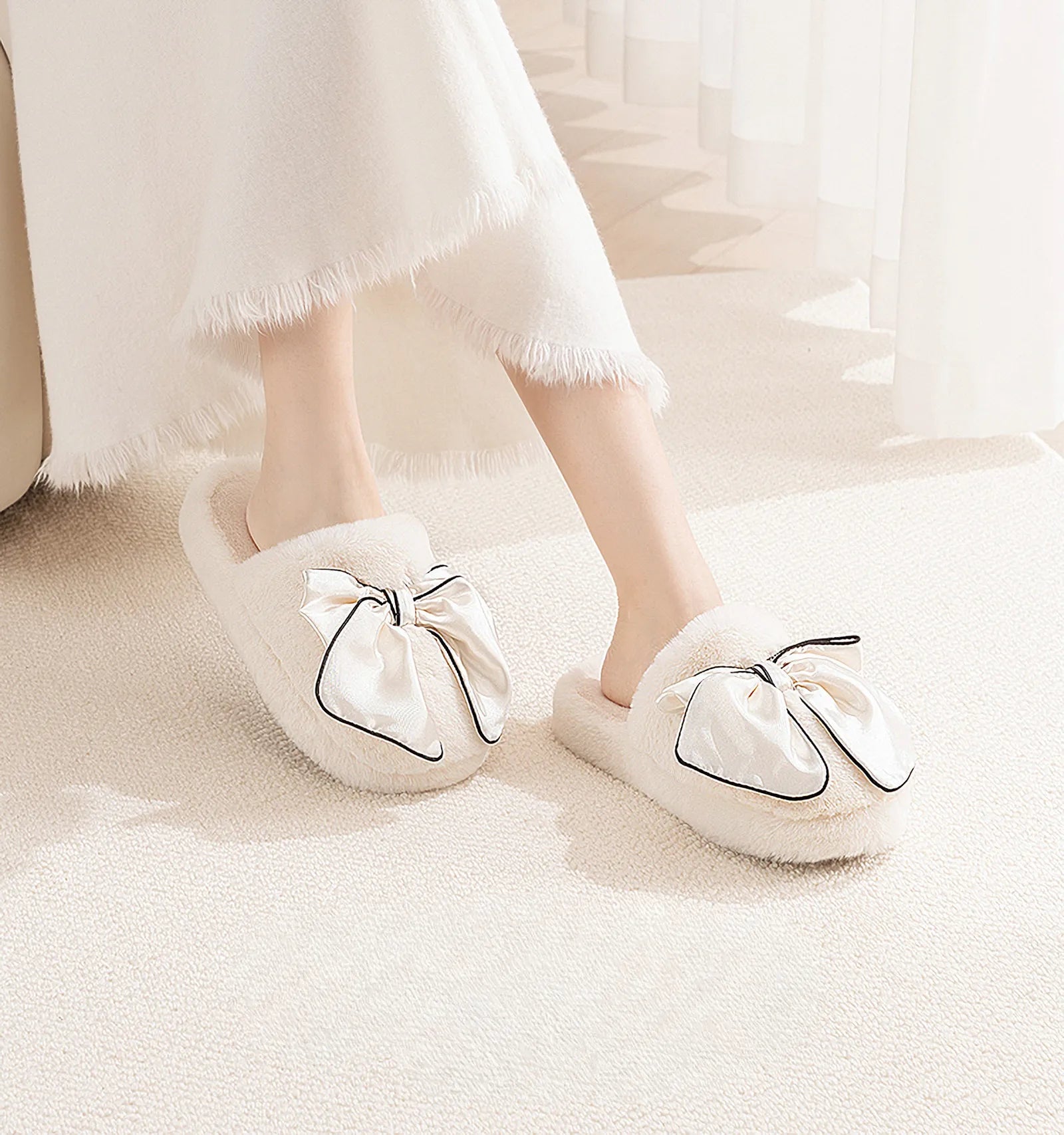 Model wearing Cream Satin Bow Faux Fur Slippers with white skirt