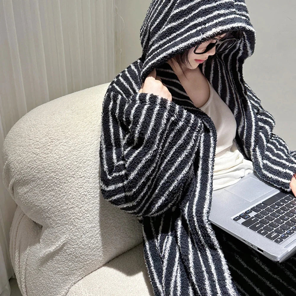 Close-up of the plush texture on the shoulder and hood of the black and white striped flannel fleece pajama set - RoomDen.