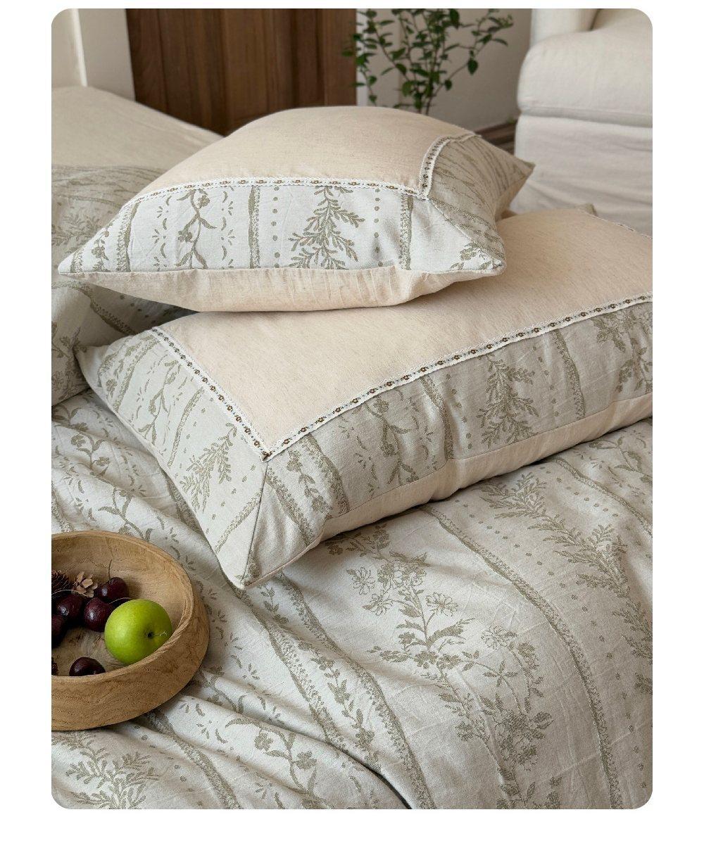 Meriwyn Botanical Linen-Cotton Bedding Set – close view of joined botanical and plain fabrics on the duvet - Roomden