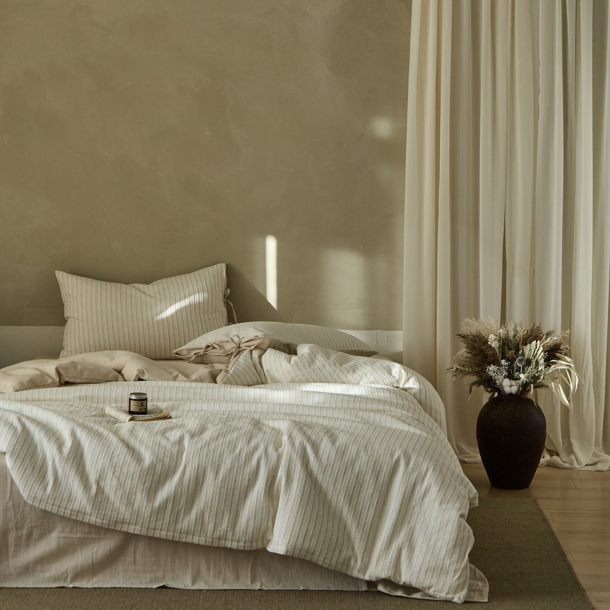 Ashfield Fine Jacquard Stripe Bedding Set – Wide view of fine striped bedding in a warm neutral room - Roomden
