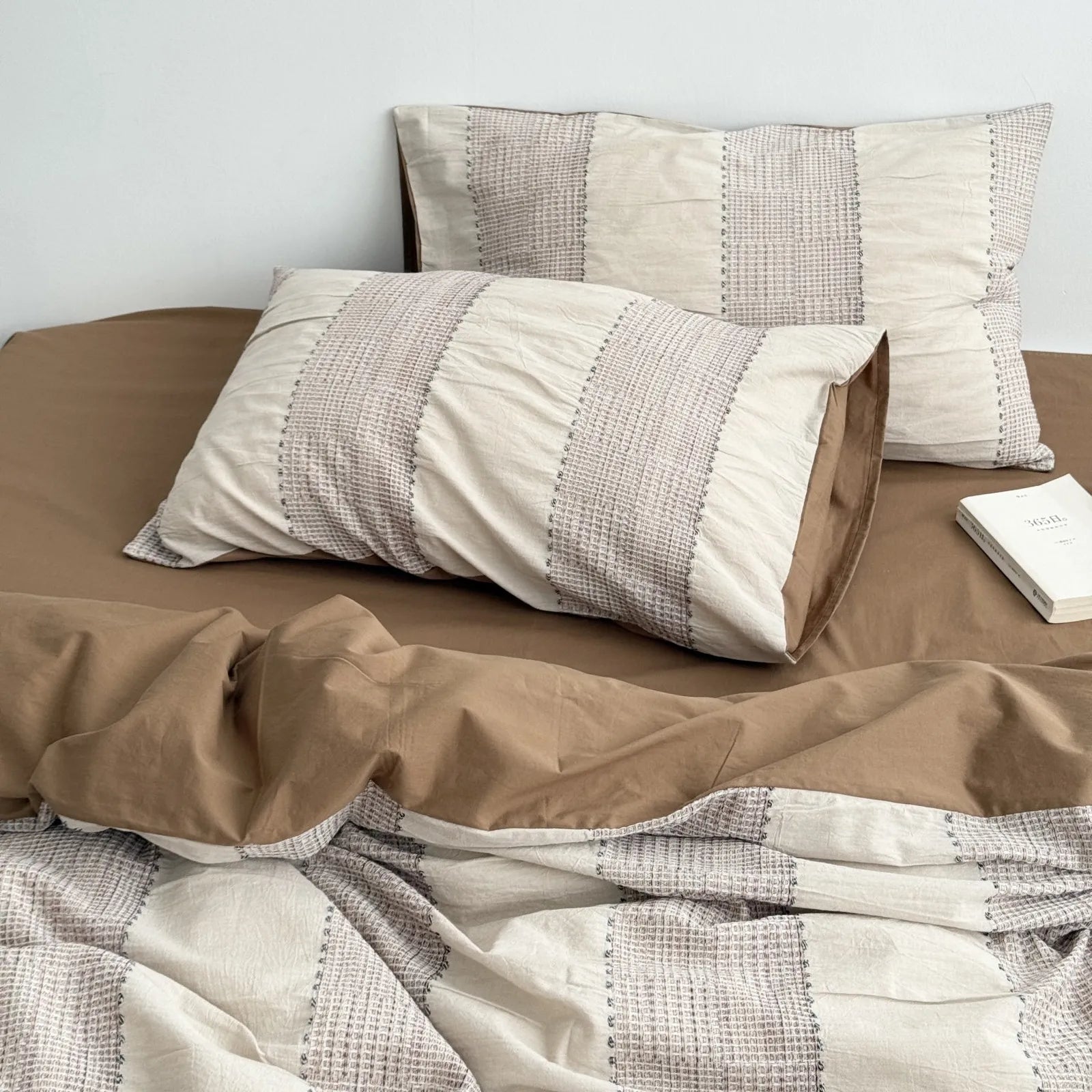 Mocha Brown variant of the textured woven stripe bedding set, showing the duvet cover and pillowcases.