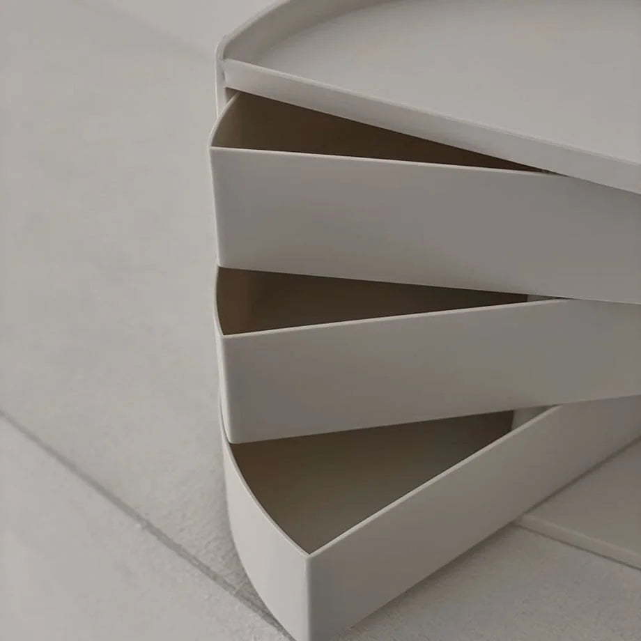 Close-up of the fanned-out swivel drawer mechanism of the makeup organizer. - RoomDen