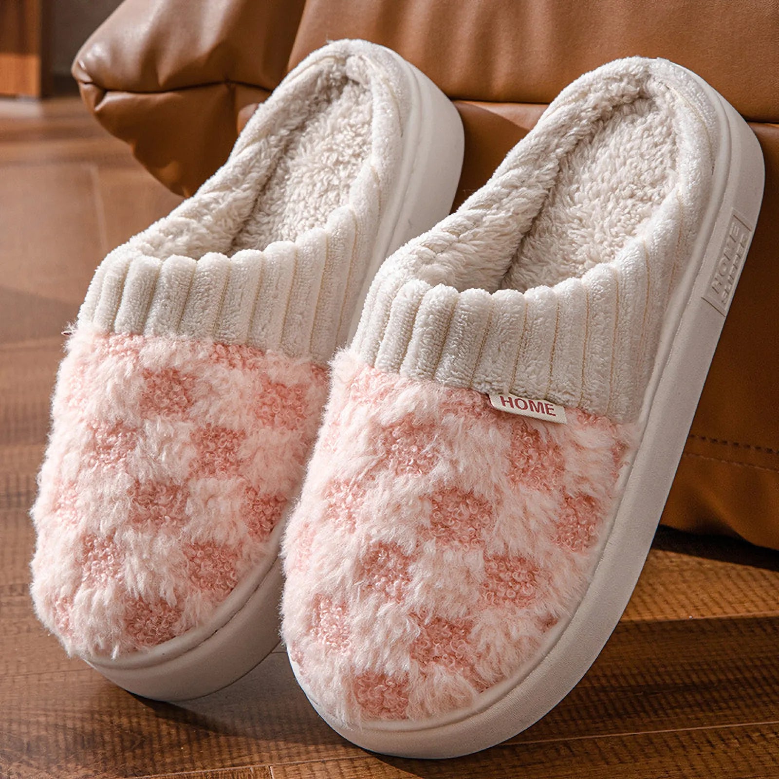 Close up of pink and white fuzzy fleece slippers with knit cuff - RoomDen