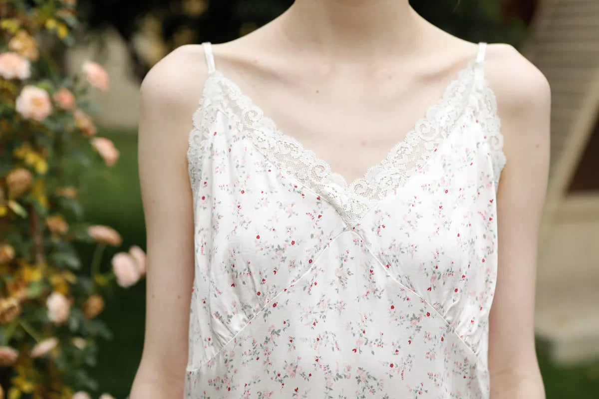 Detail texture shot of cotton sateen fabric with pink floral print and lace - RoomDen