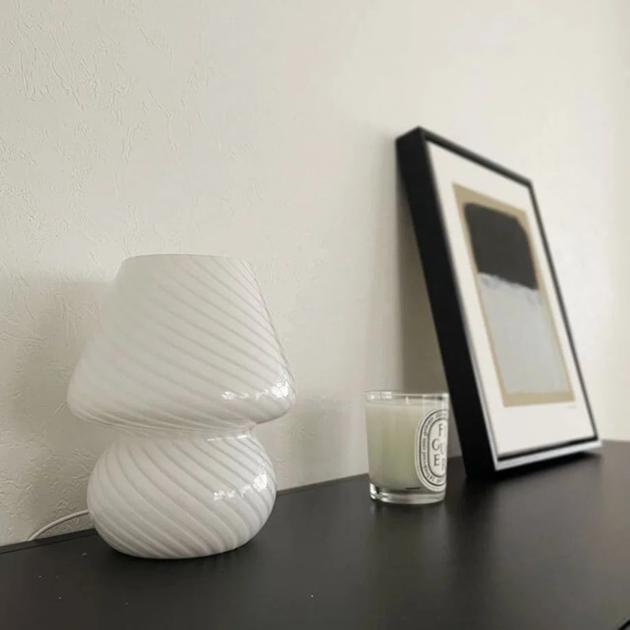 Side view of the unlit white Swirled Glass Mushroom Lamp, emphasizing its sculptural form.