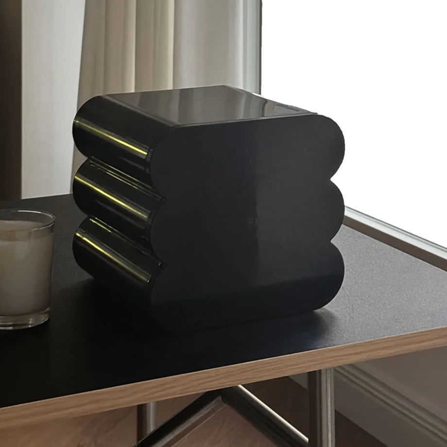 Back view of the stacked wavy makeup organizer, showing its solid black, curved construction. - RoomDen