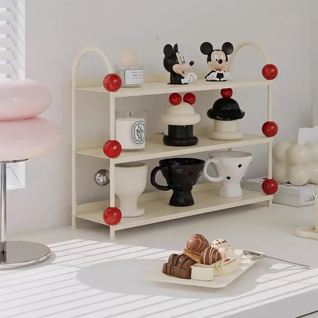 Angled view of the Creamy White & Red desk shelf, showcasing its three-tier storage capacity - RoomDen.