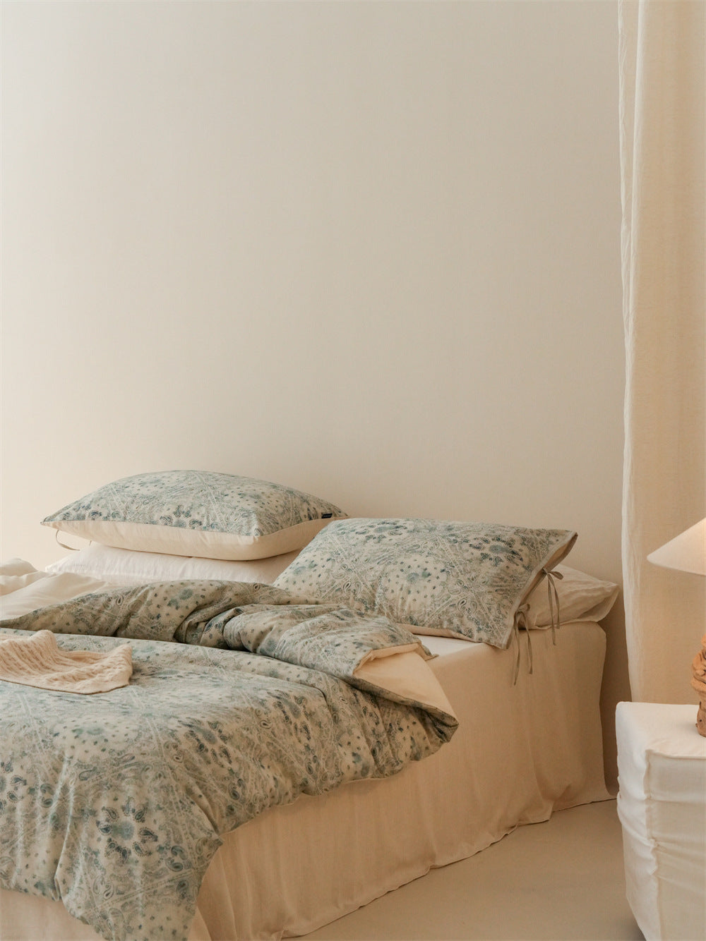 Stillgarden Blue Botanical Scroll Cotton Linen Bedding Set – Angled view of the blue-green floral bedding - Roomden