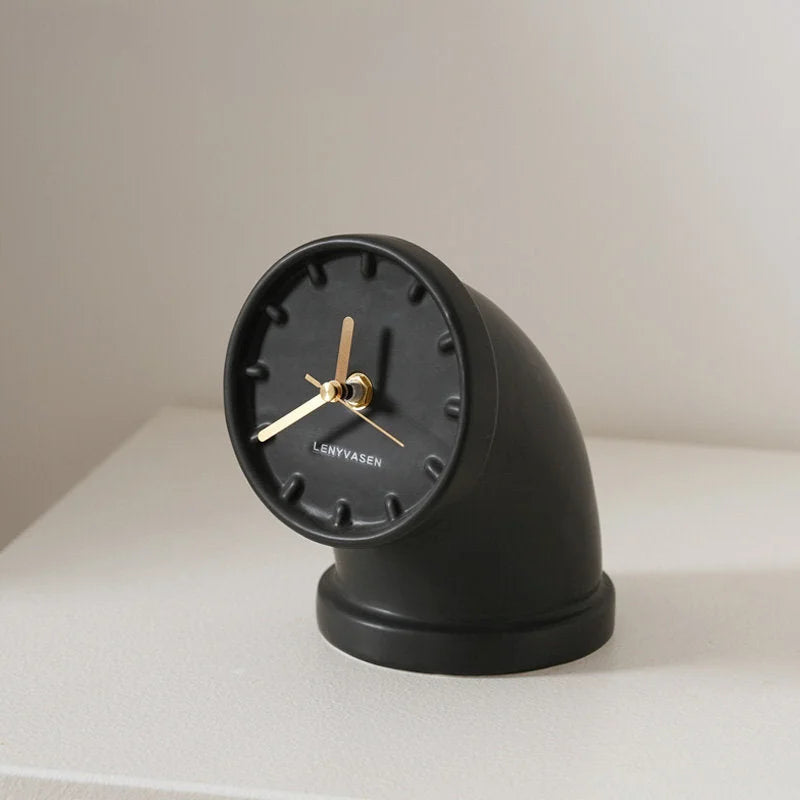 Matte black Industrial Pipe Ceramic Table Clock on a white surface against a neutral background - RoomDen