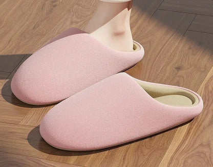 Pink soft cotton house slippers on feet sunlight - RoomDen