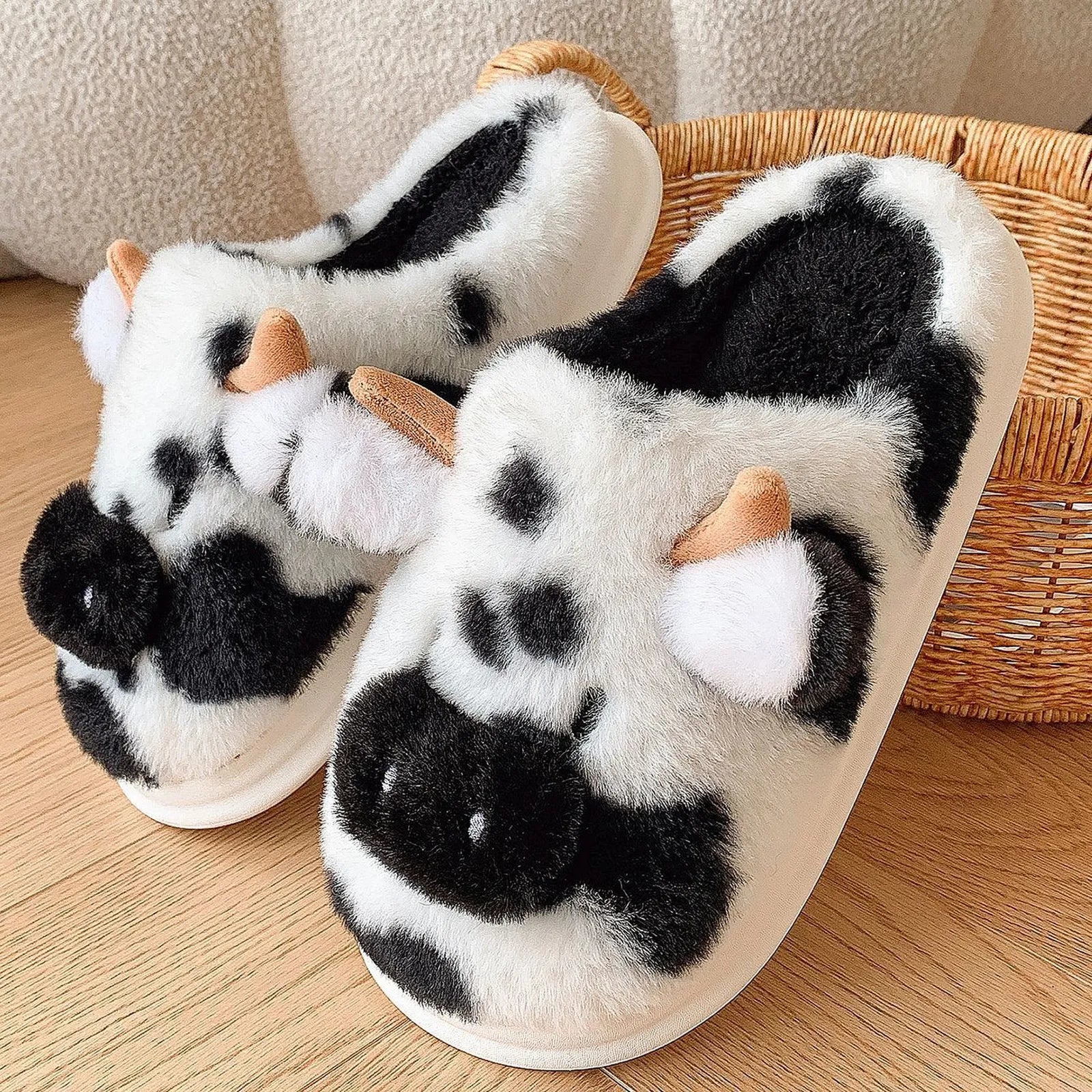 Close-up detail of Black and White Cow Print slipper showing plush material and snout design - RoomDen.