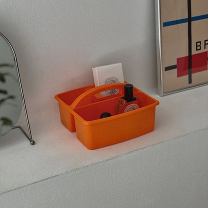 Detailed view of the orange portable caddy with skincare items inside. - RoomDen