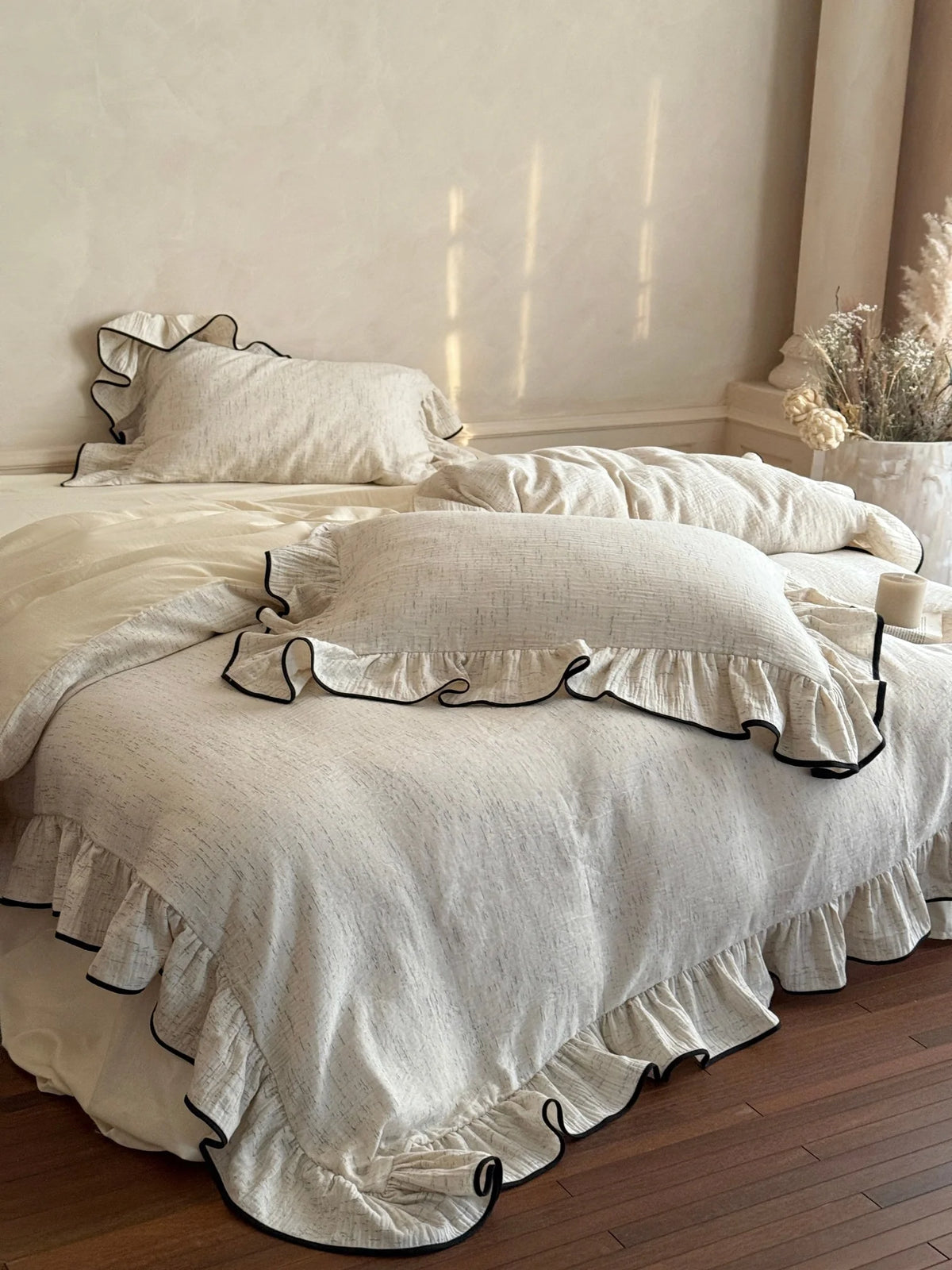 Black-piped ruffle double gauze bedding set – softly lit side-angle bedroom scene - Roomden