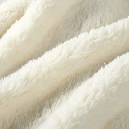 Extreme close-up of the plush, fuzzy texture of the cream flannel fleece material - RoomDen.