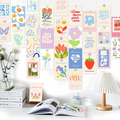 The Vibrant Danish Pastel Wall Collage Kit displayed on a white wall above a clean, organized desk with books and a lamp. - RoomDen