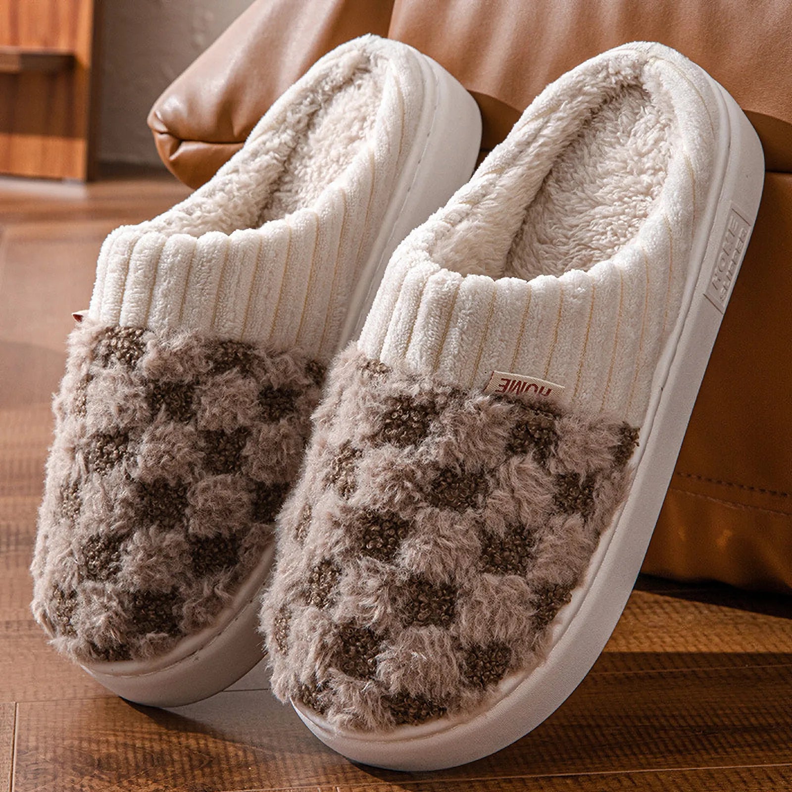 Close up of brown and white mocha checkered fuzzy slippers - RoomDen